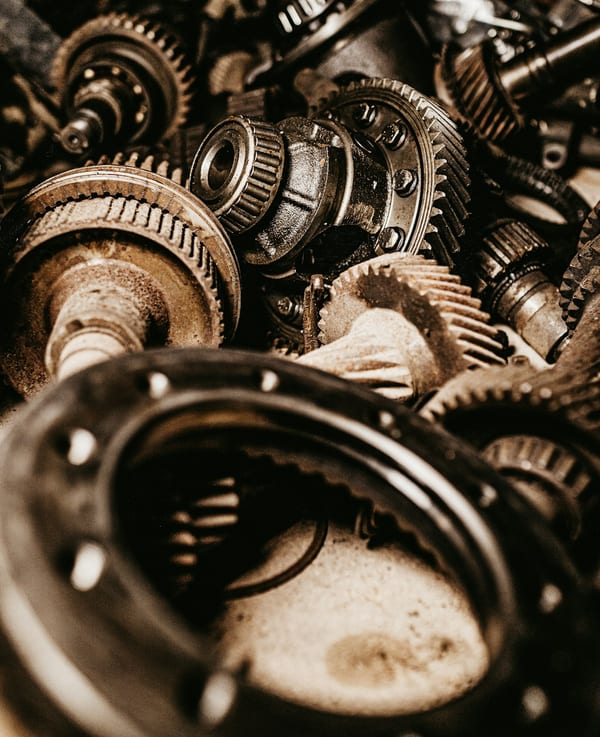 A pile of steel gears, photographed close up.